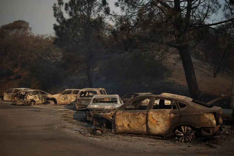 bur cars in Los Angeles fire; photo source; Reuters; Photographer: Daniel Cole