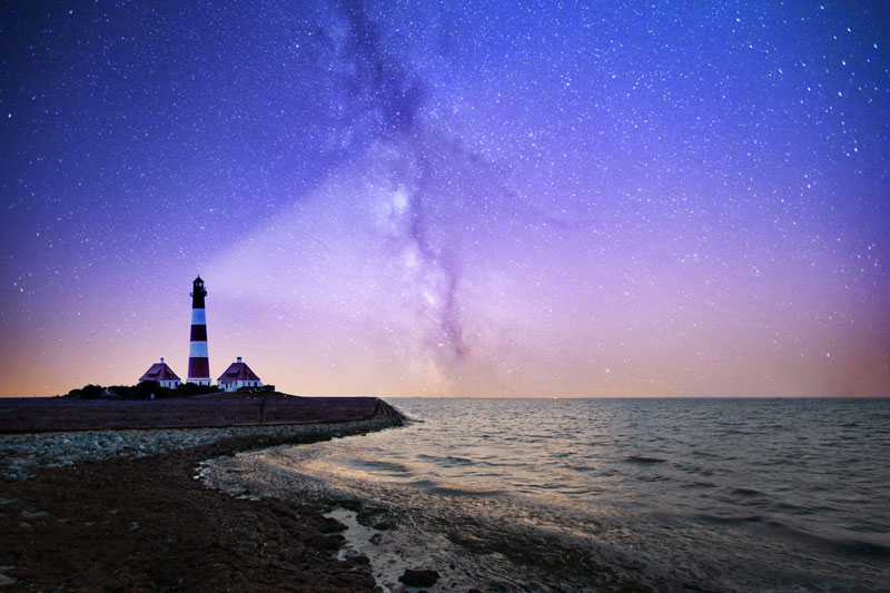 Lighthouse at night with the Milky Way; Photo source: Ansplash; Photographer: Robert Wiedemann