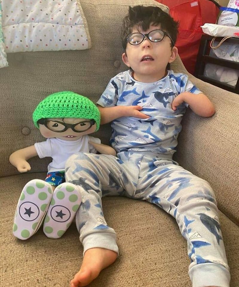 The boy in blue and his doll