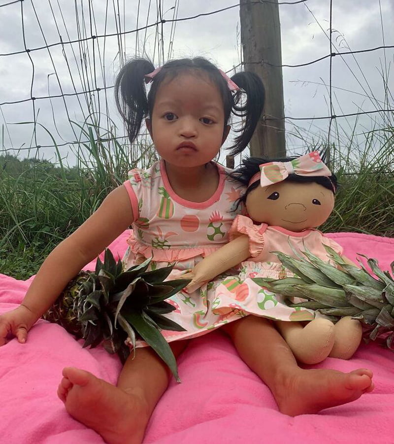 A colored girl and her doll