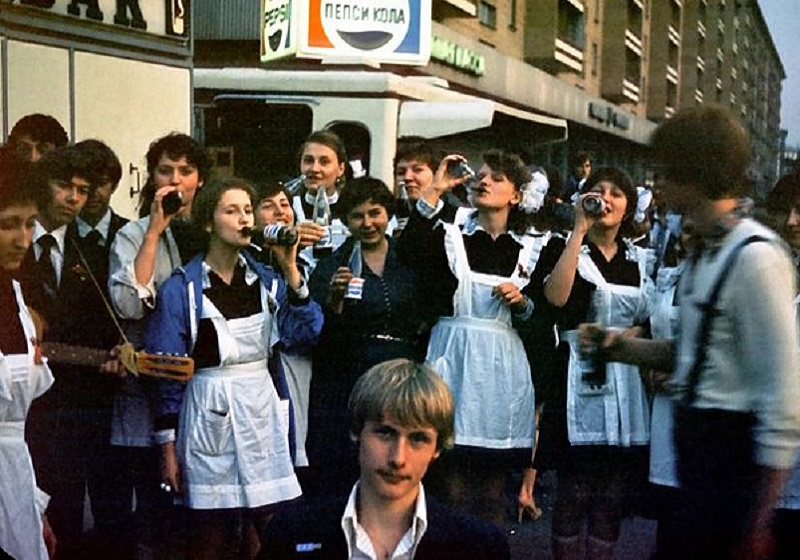 Pepsi Cola in the hands of school studes in year 2; Photo Source: Wiki Media; Photographer: IvTorov