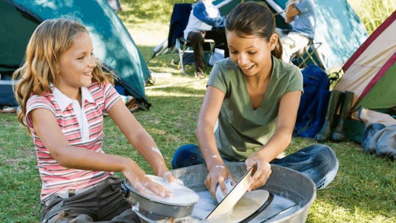 washing dishes in nature; Photo source: mag.zigocamp.com. Photographer: Unknown
