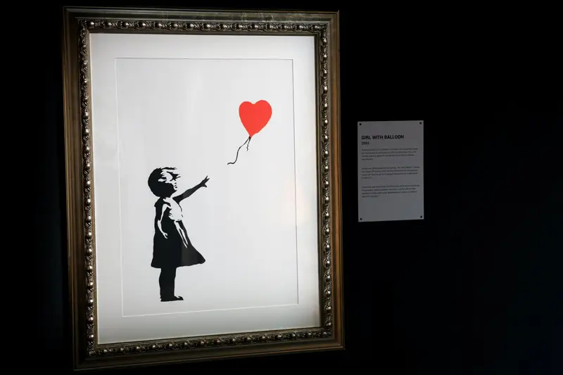 Paiing the girl and the balloon in the frame; Banksy's effect