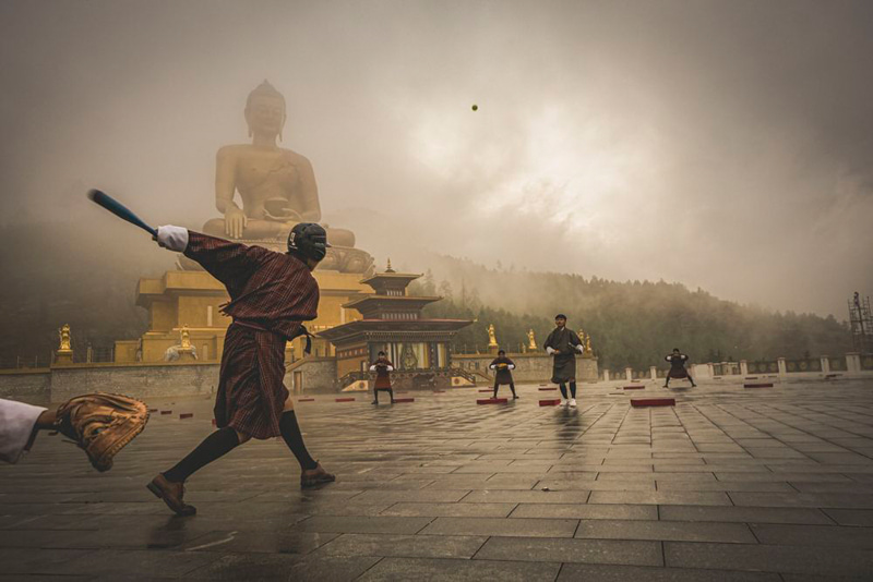 Playing in the vicinity of the Buddha statue in butane; Photographer: Matthew Desais from <a href=
