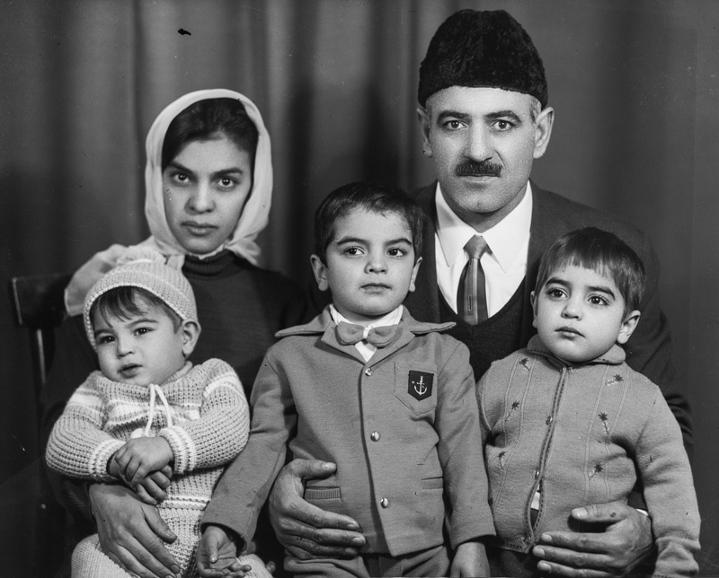 Pares of children in the camera frame of the old photographer