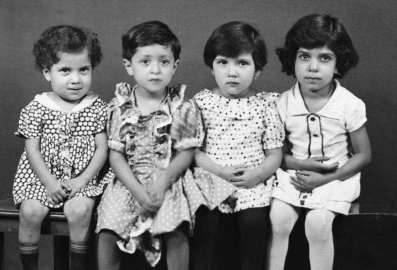 Black photo of four children in ancie Iran