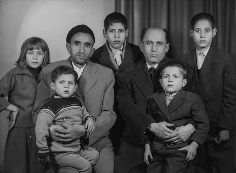 Black and white photos of fathers and children in ancie Iran