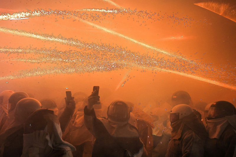   Explosions of firecrackers at the Fire Festival of Bee Hives in Taiwan; Photo Source: Theguardian; Photographer Name: Ann Wang