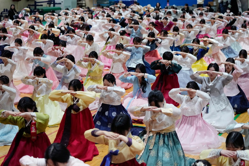   Joi Graduate High School Graduate Ceremony in Seoul, South Korea; Photo Source: Theguardian; Photographer Name: AHN Young-Joon