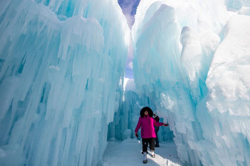 The presence of people in the snow caves and ice castles New Hampshire, America; Photo Source: Theguardian; Photographer Name: Joseph Prezioso