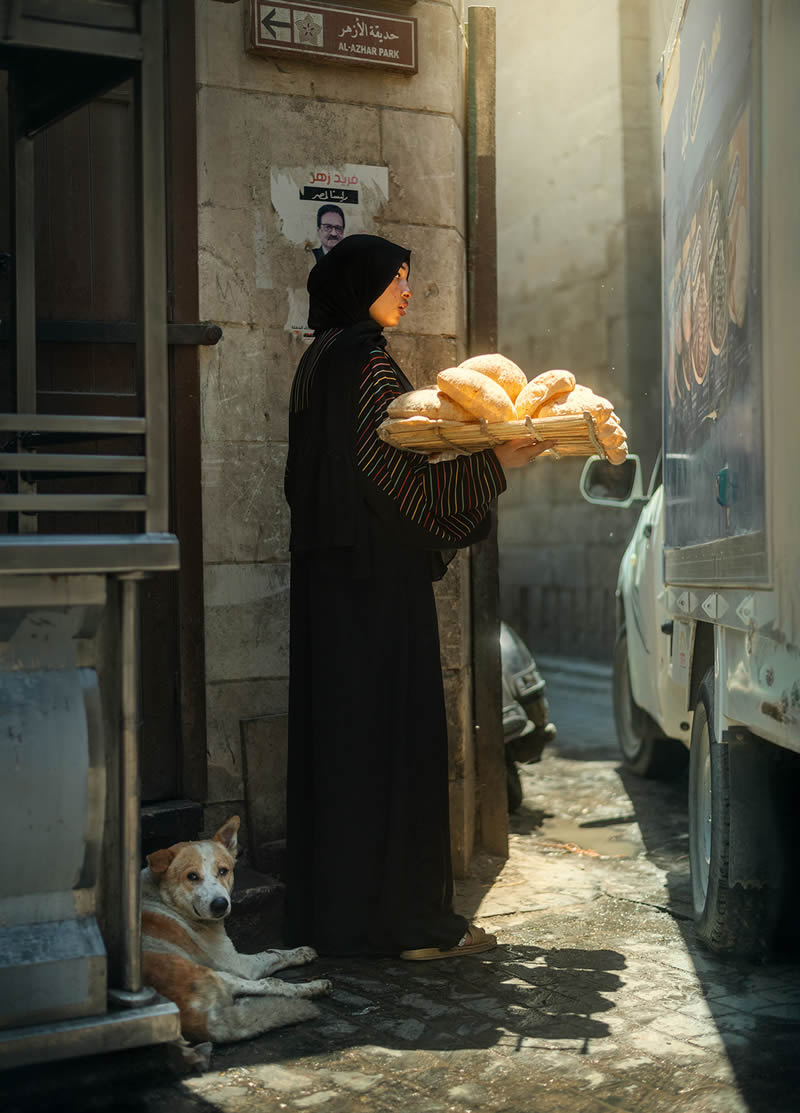 A woman with bread tray on the streets of Cairo