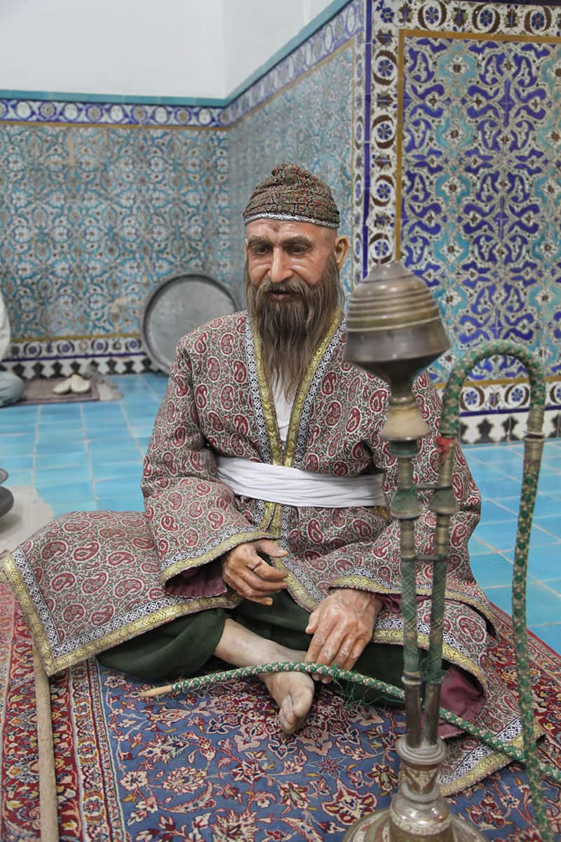 Statue of a man with hookah in the bathroom of Ganjali Khan Kerman; Photographer: Mohammad Shojaee