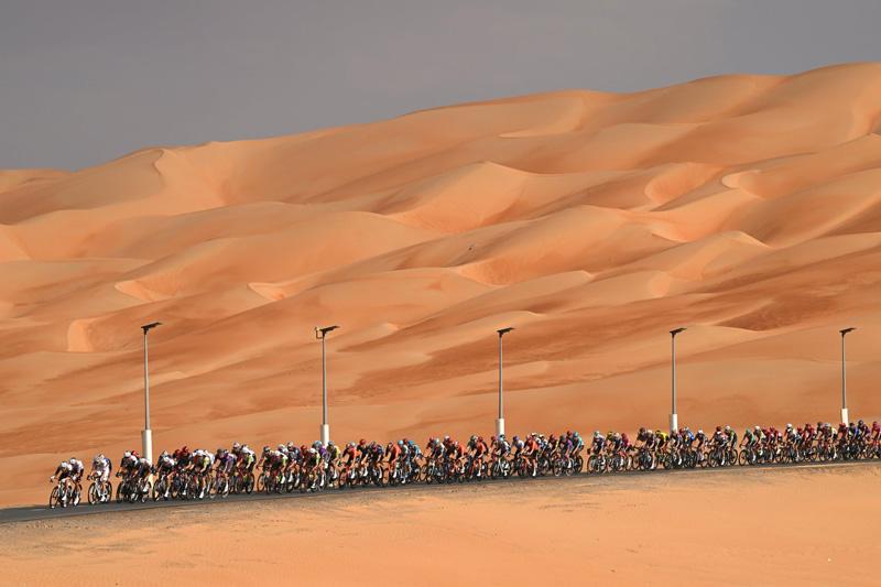 Cyclists at the stage of one of the seveh UAE Tour; Photo Source: Theguardian; Photographer Name: Dario Belingheri