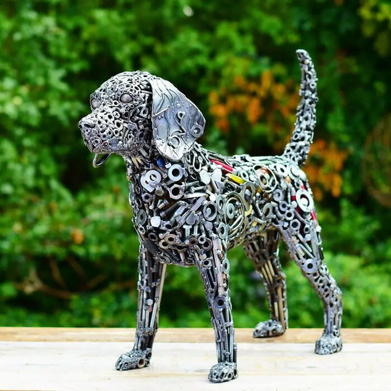 The statue of a small dog with recycled materials