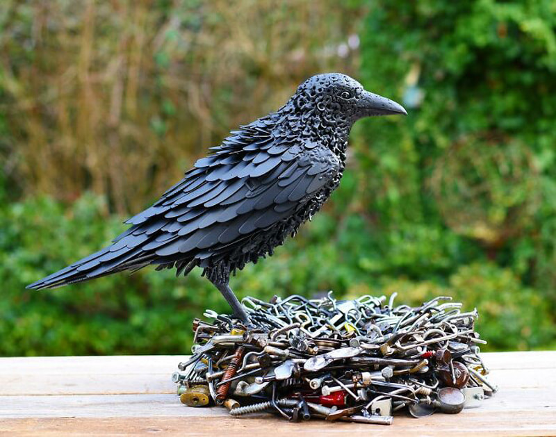 Crow statue with recycled materials
