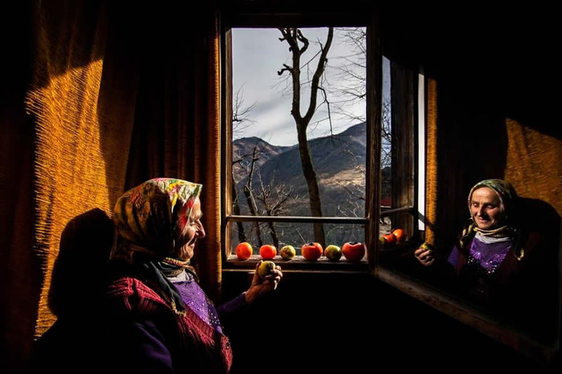 The rural woman left by the window