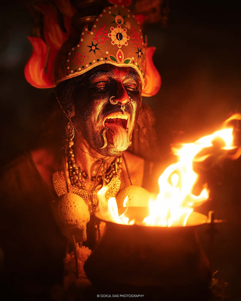 Indian man on the side of the fire coainer