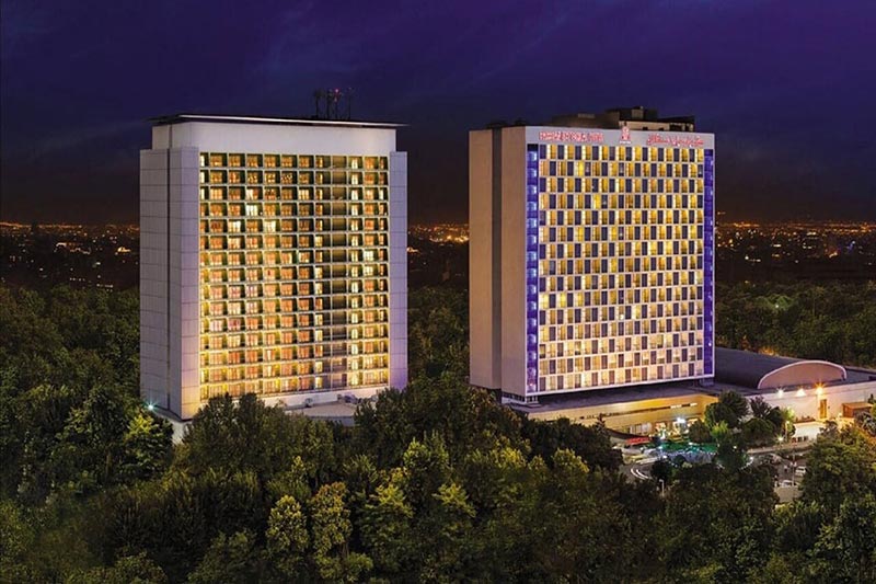 Buildings of Parsian Esteghlal at night; Photo Source: Booking.ir; Photographer: Unknown