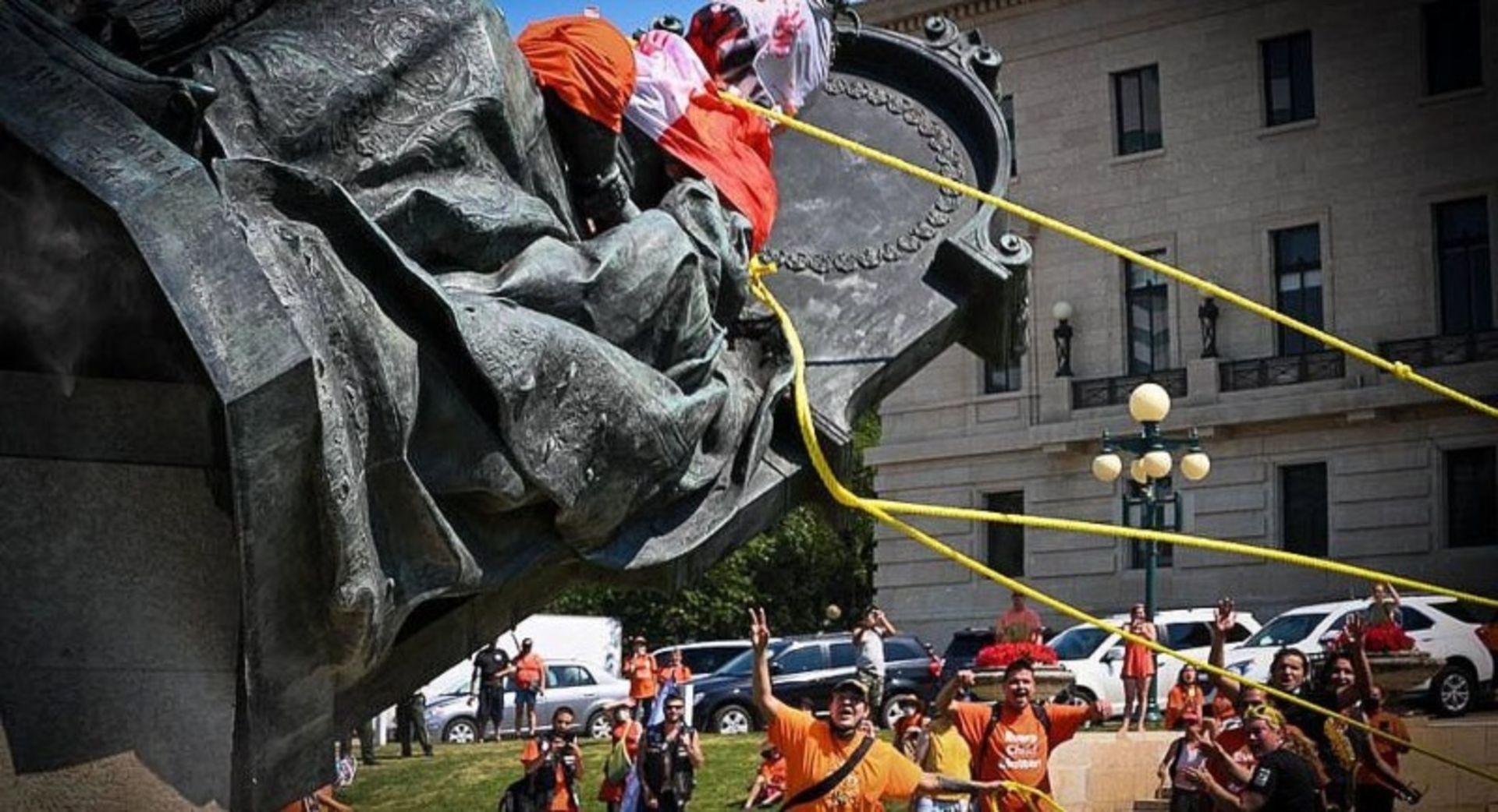 The overthrow of the statue of Queen Victoria in fro of the Manitoba legislature building  