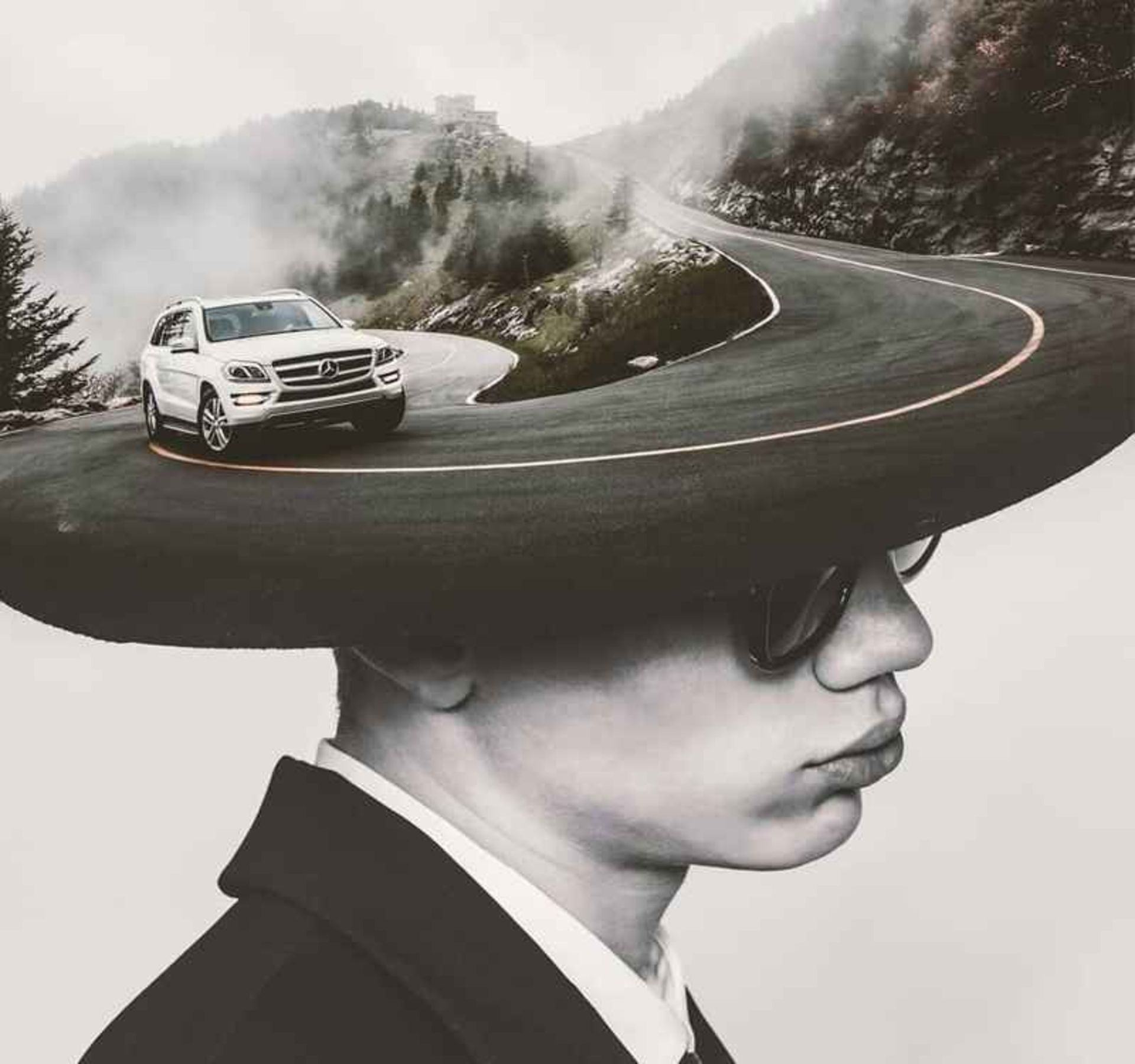 Surreal photo of the mouain road on a man's hat