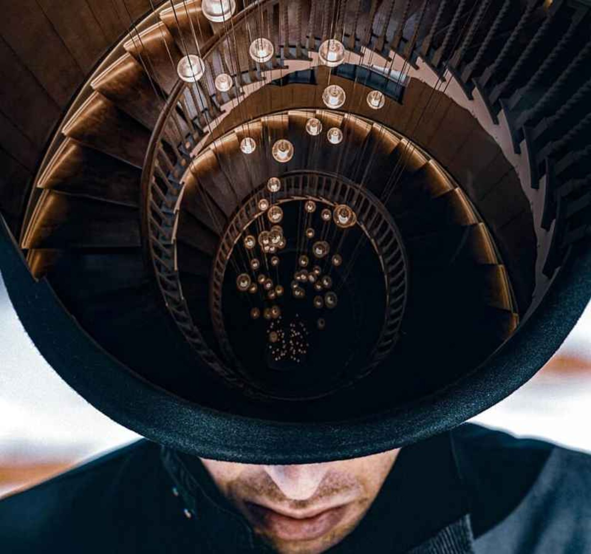 Surreal photo of the staircase inside a man's hat