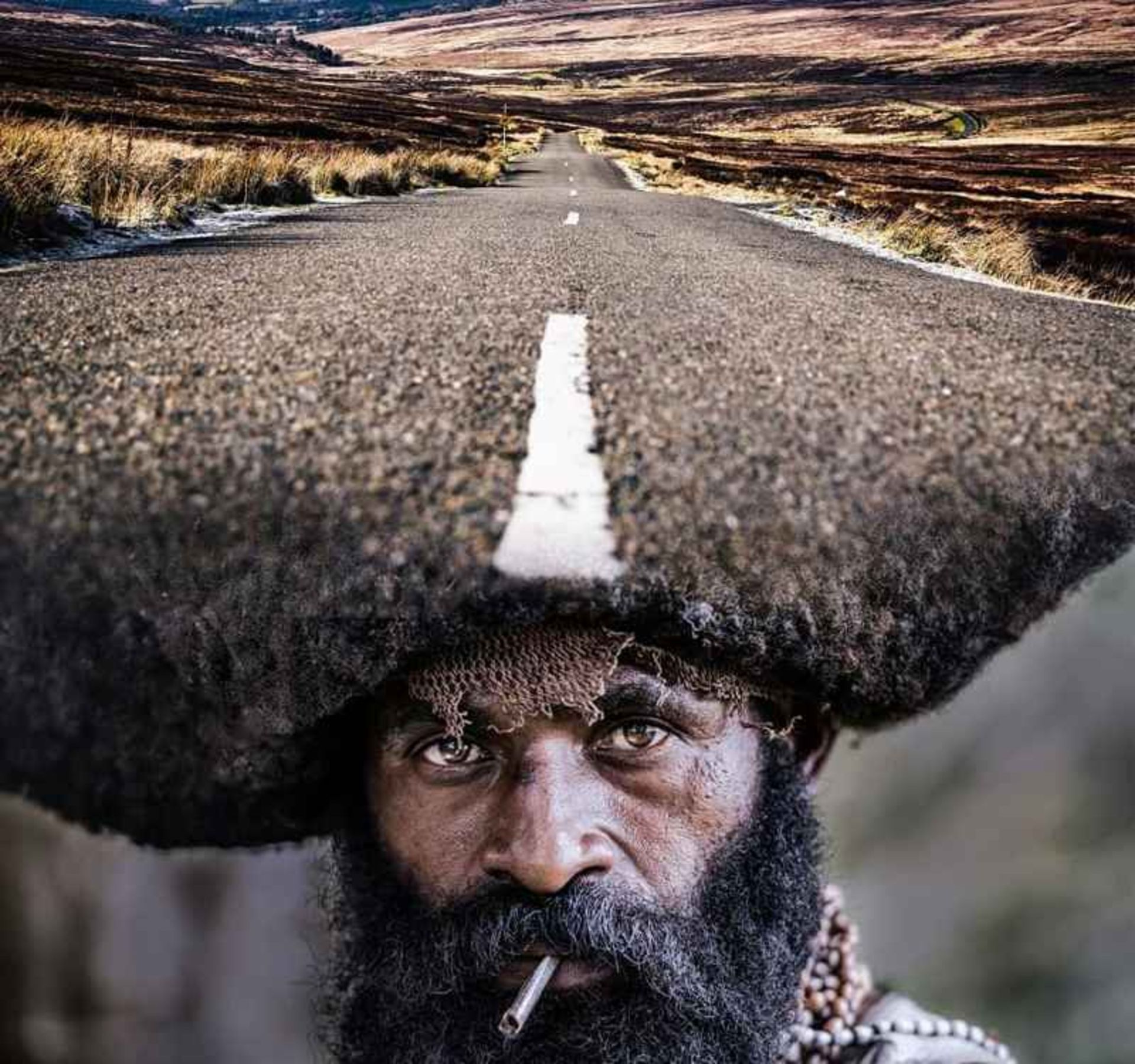 Indian man's hair that turned io asphalt road