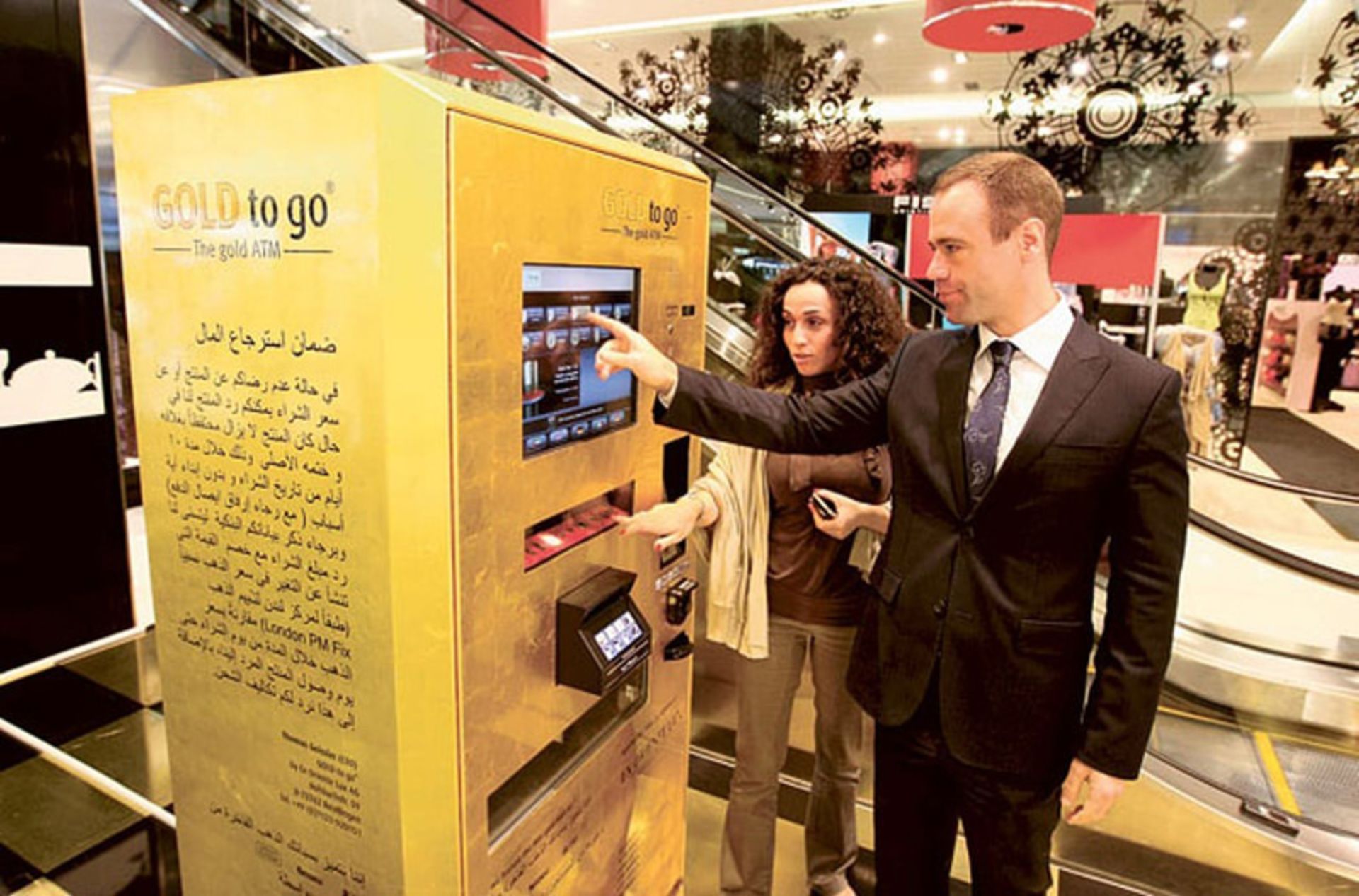 Tourists using Dubai Gold ATM