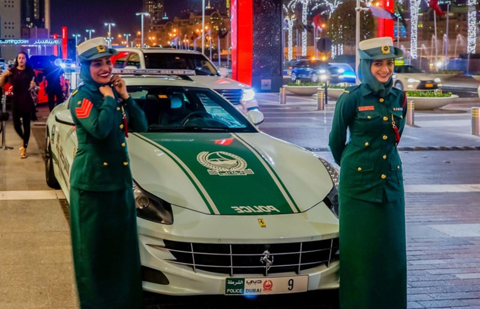 Female police with green uniform in Dubai