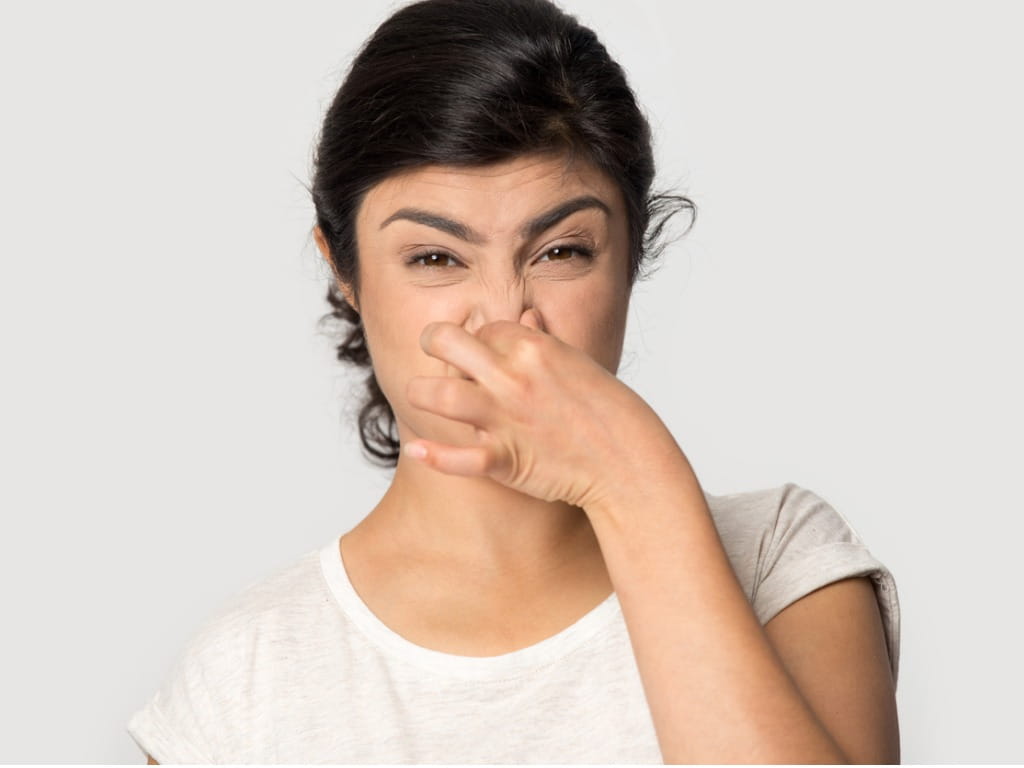 What is the cause of bad urinary smell in men and women?