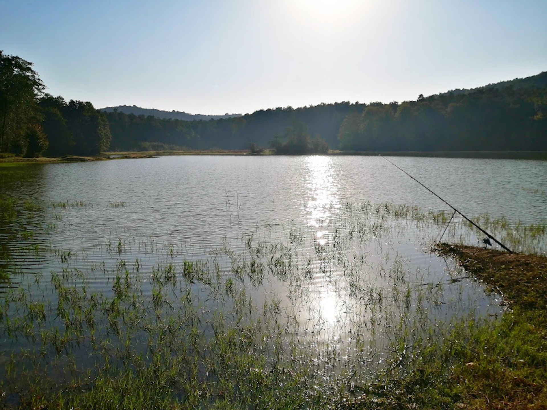 Reflection of sunlight in the water of the Lefur Dam