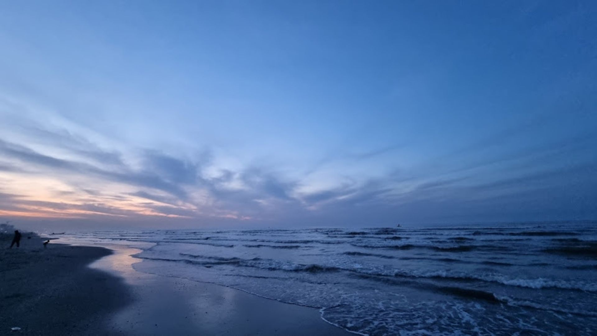 Sandy beach and sea motel's sea in the evening