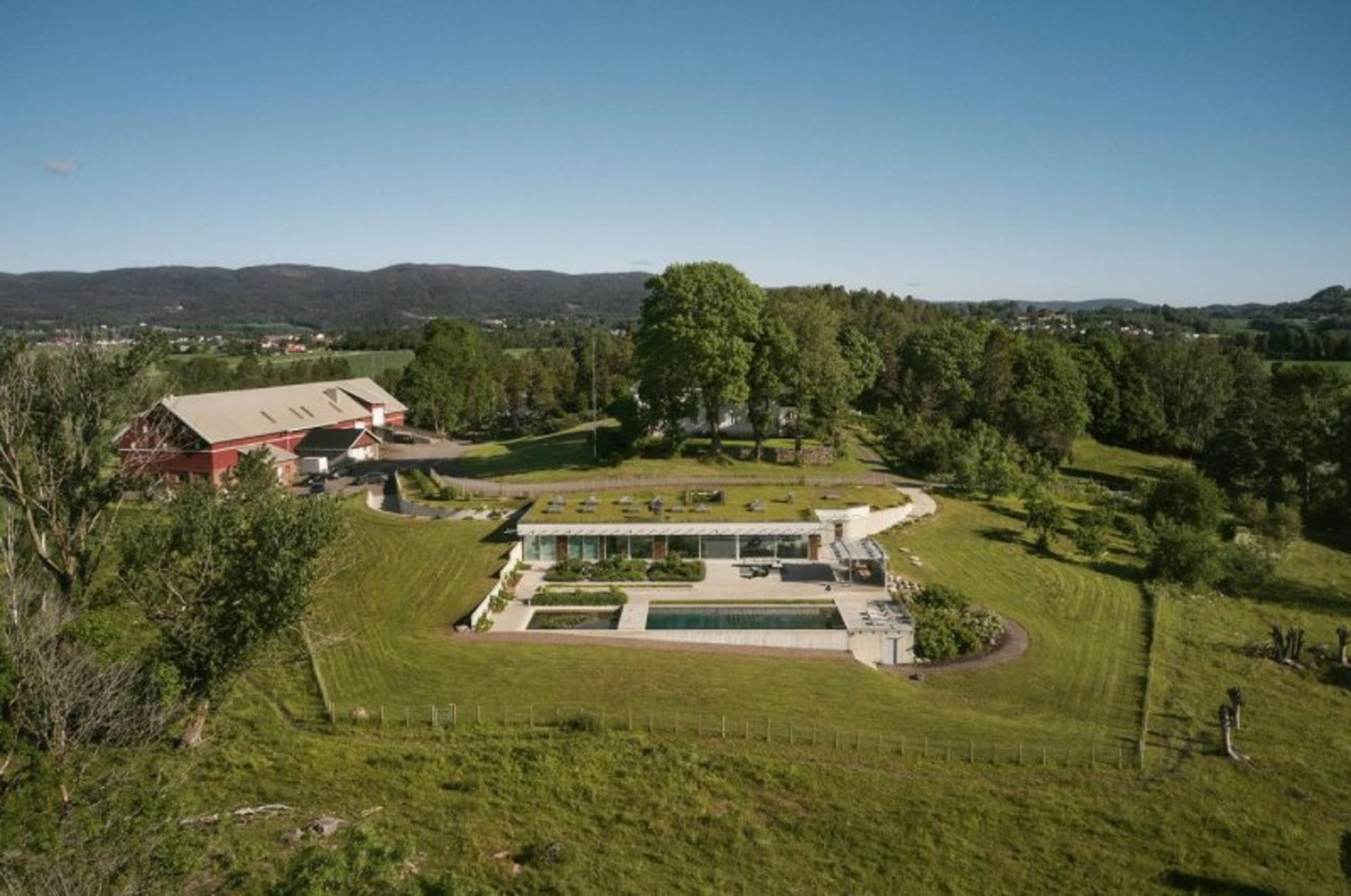 Home with a green roof in the heart of nature