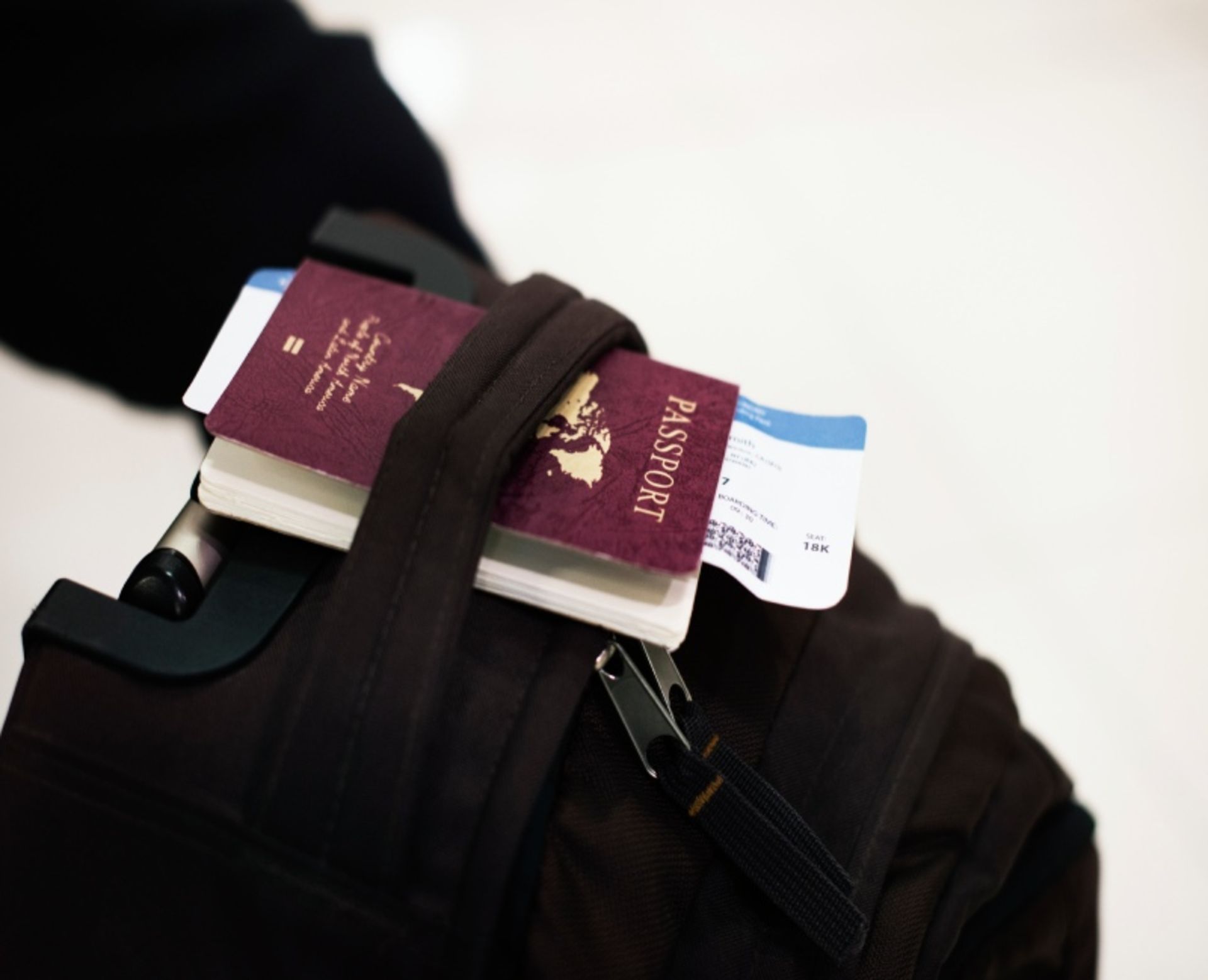 Passport and tickets on the backpack