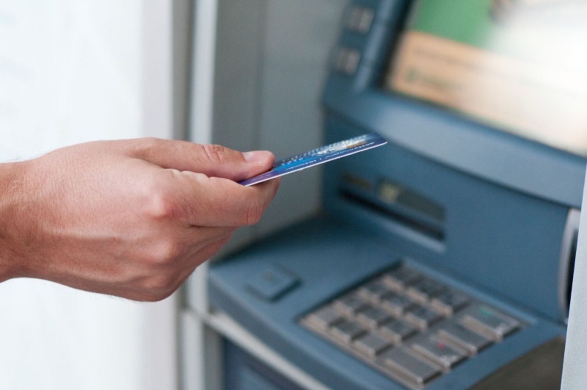 Use the bank card in the ATM device