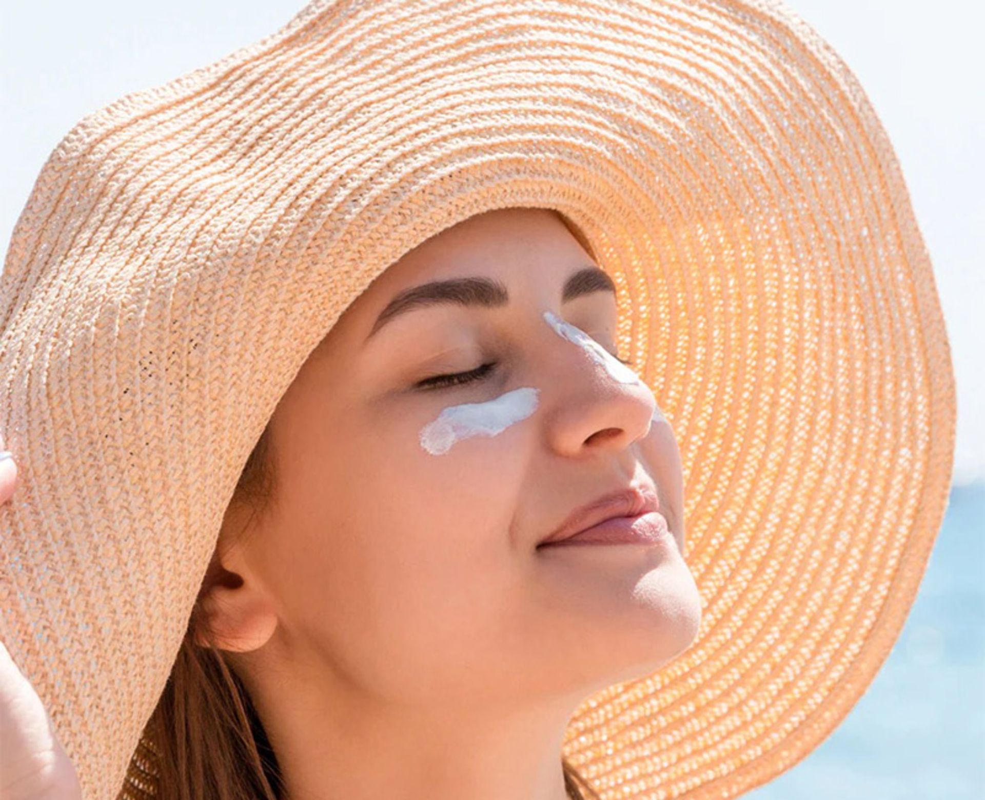 Sunscreen on the face of the beach