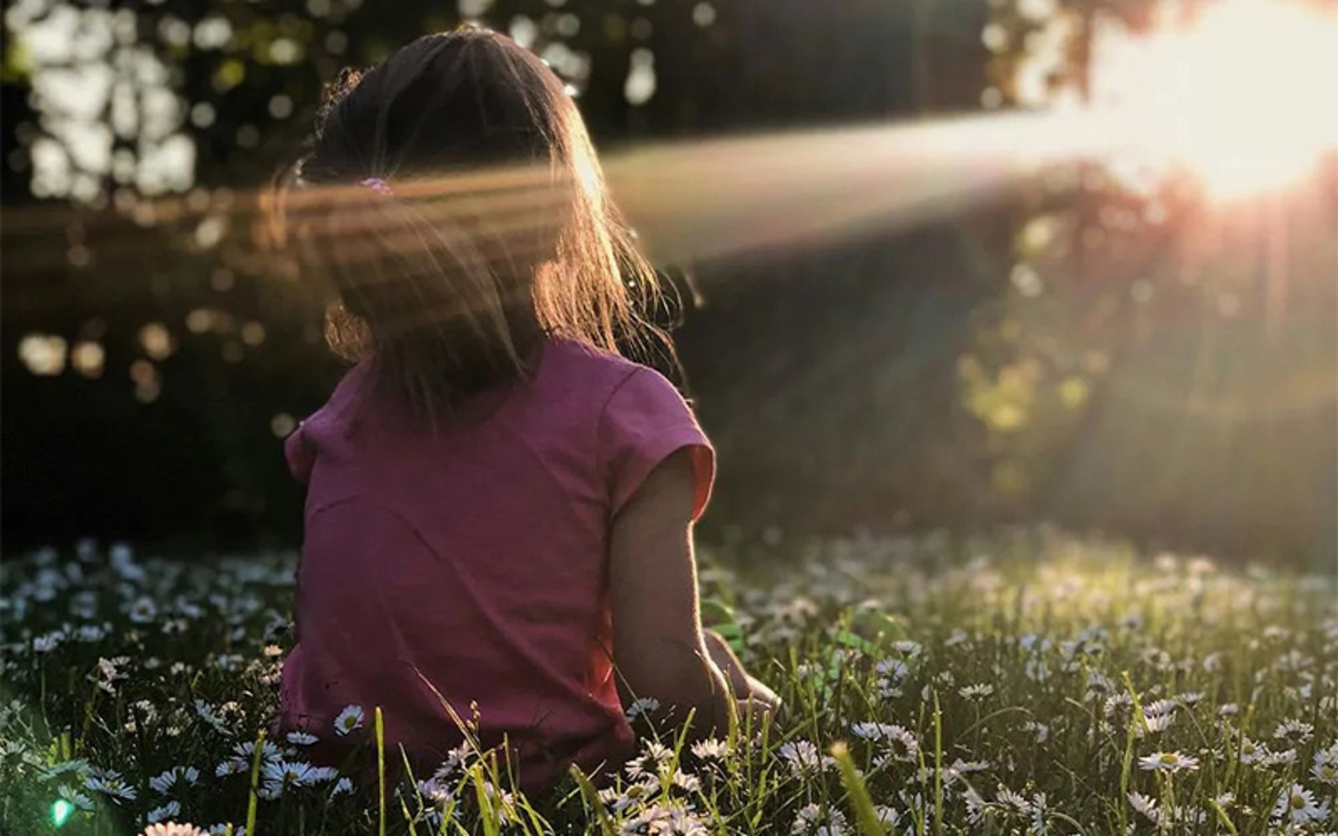 The girl on the farm facing the sunshine