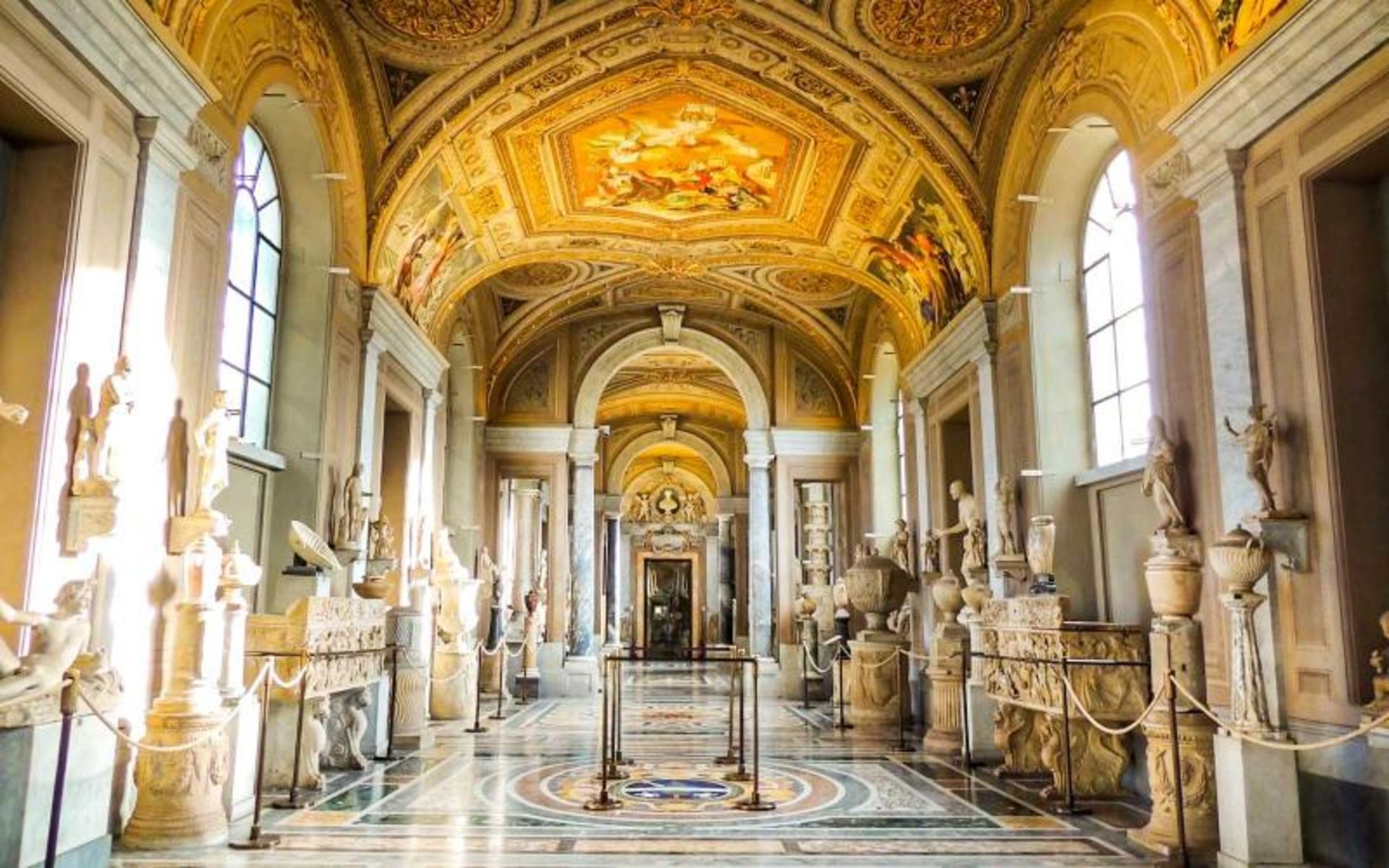 The ierior of the Vatican Museum with differe sculptures