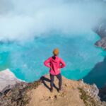 Tourism with red dress in the turbulent mouth of Ajan