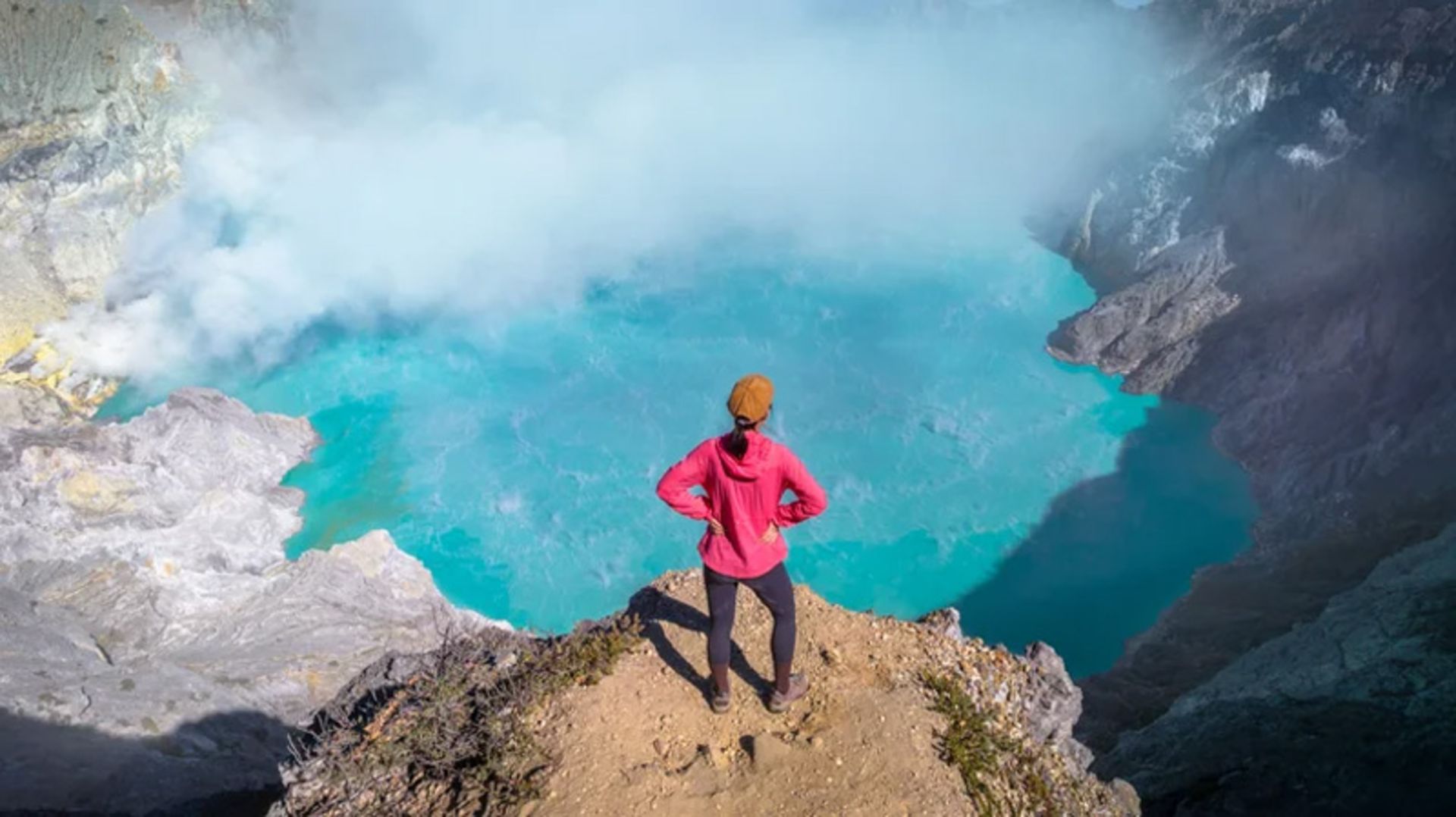 Tourism with red dress in the turbulent mouth of Ajan