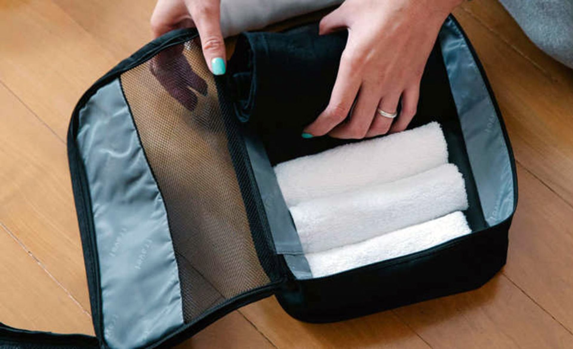 Towel and travel sheets in the suitcase