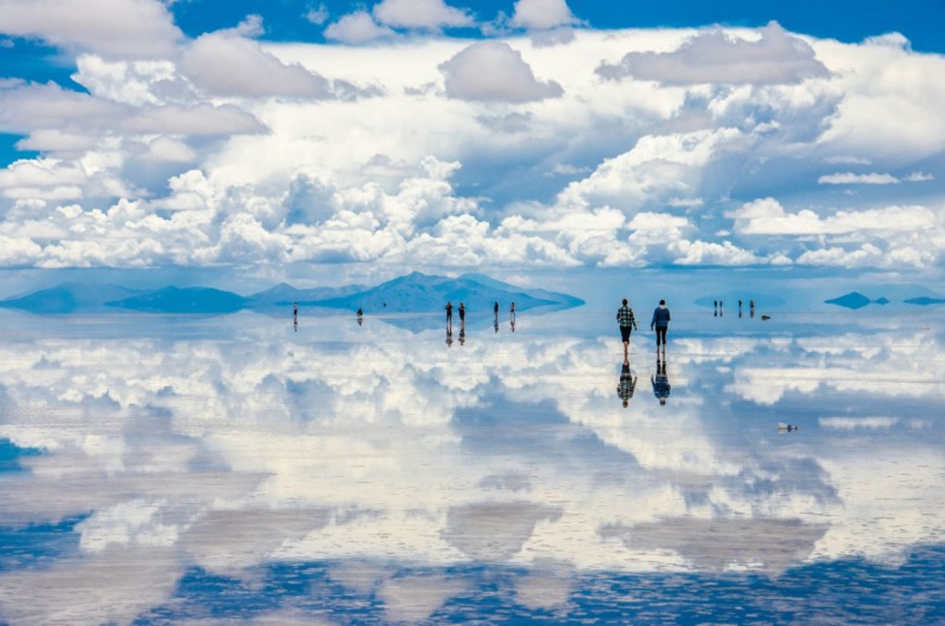 Reflection of blue sky and white clouds in the desert desert