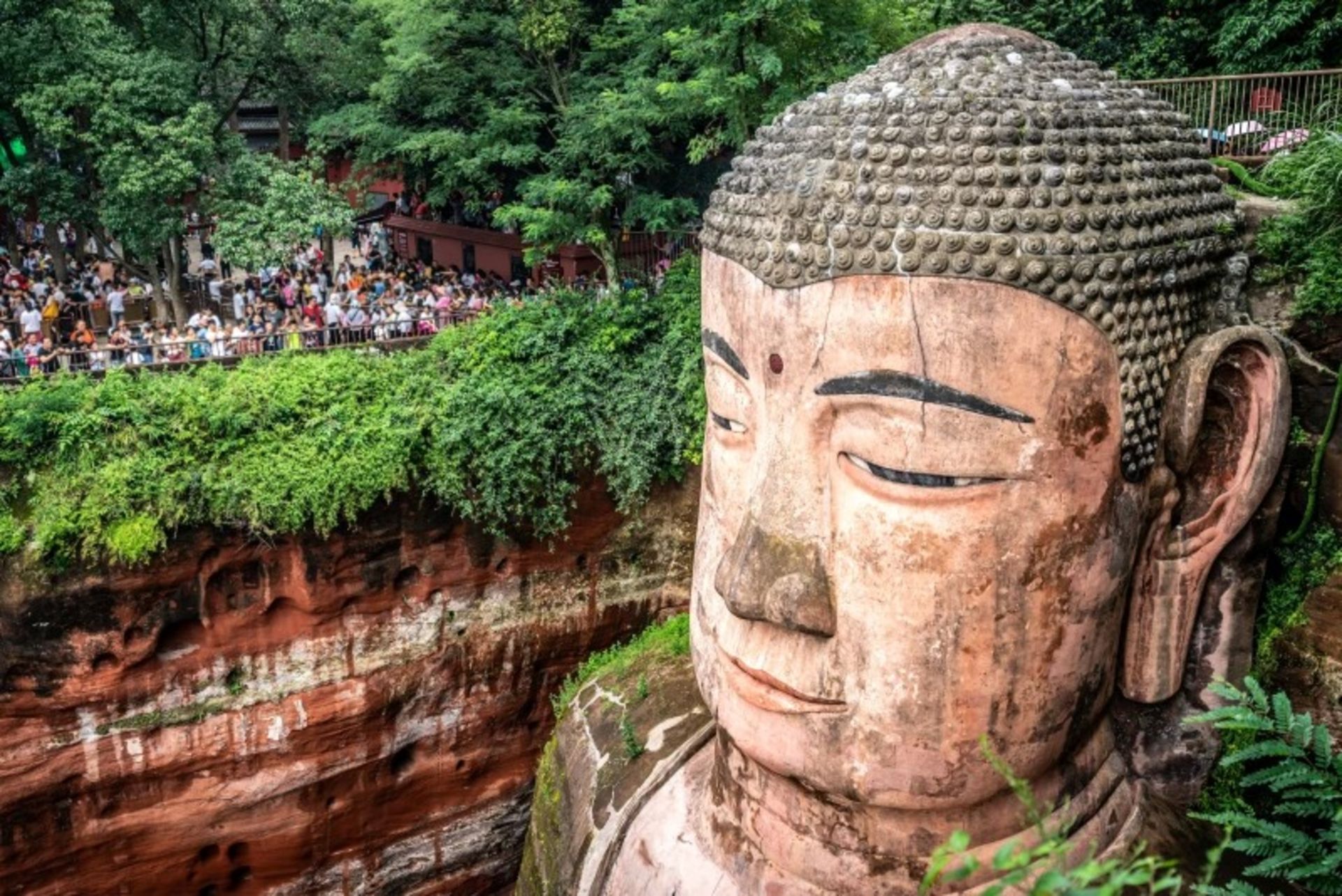 Tourists near the Gia Buddha Statue, China