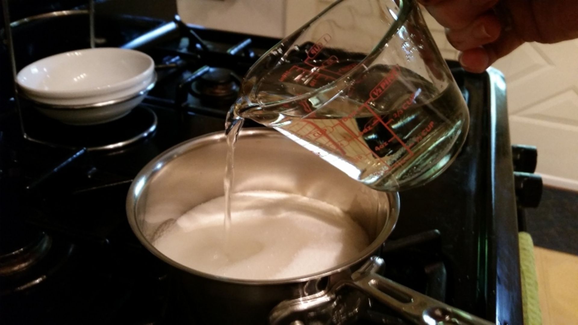 Add water to sugar to make syrup