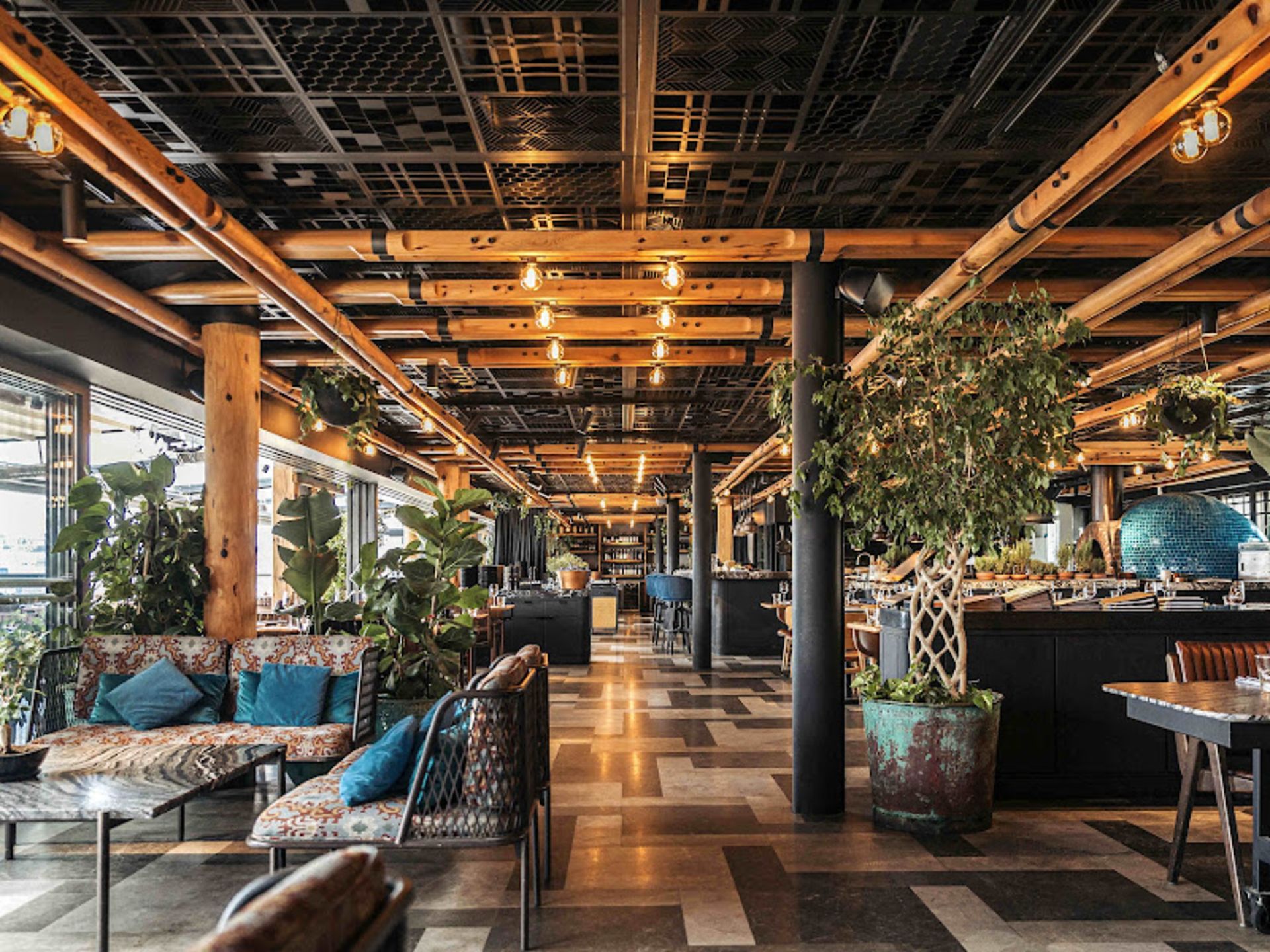 Wooden roofs and modern chairs at Morour Restaura