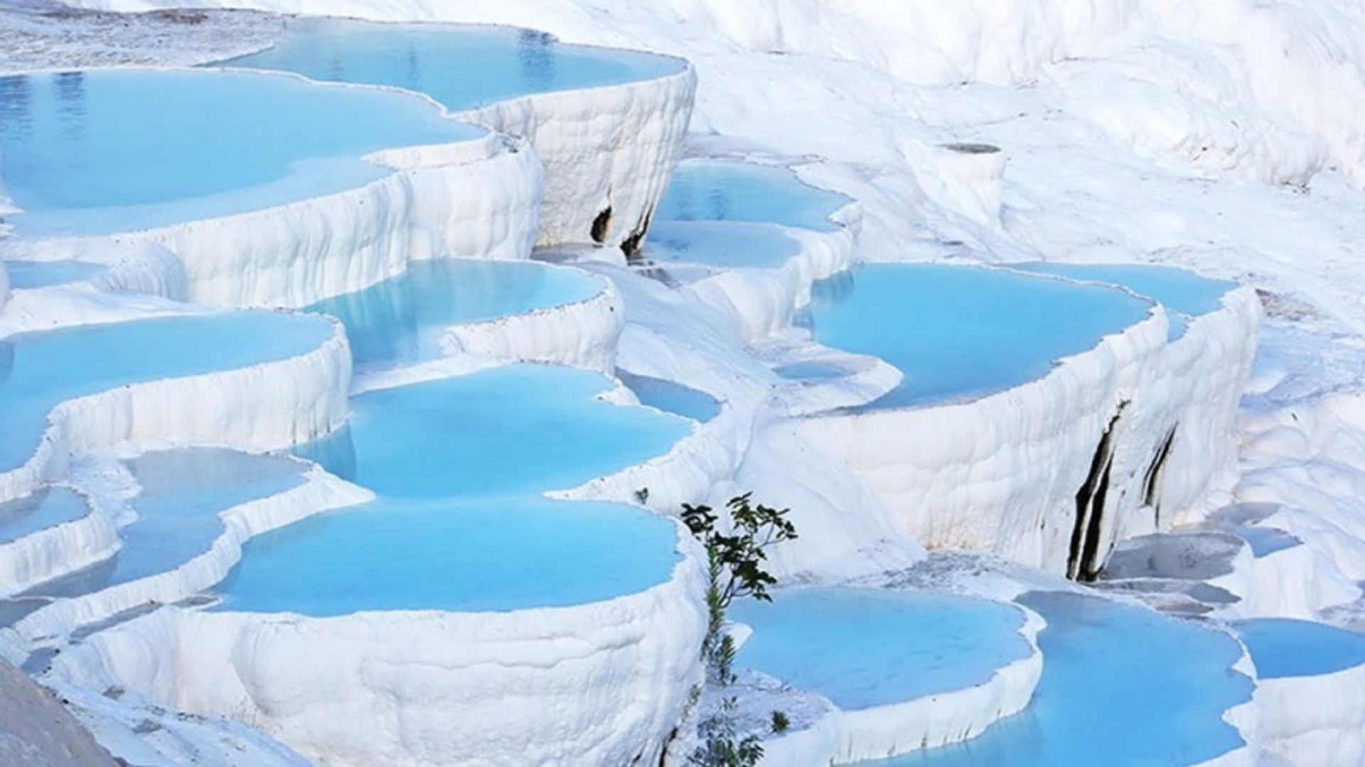 Pamukaleh staircase and white springs with clear and blue waters