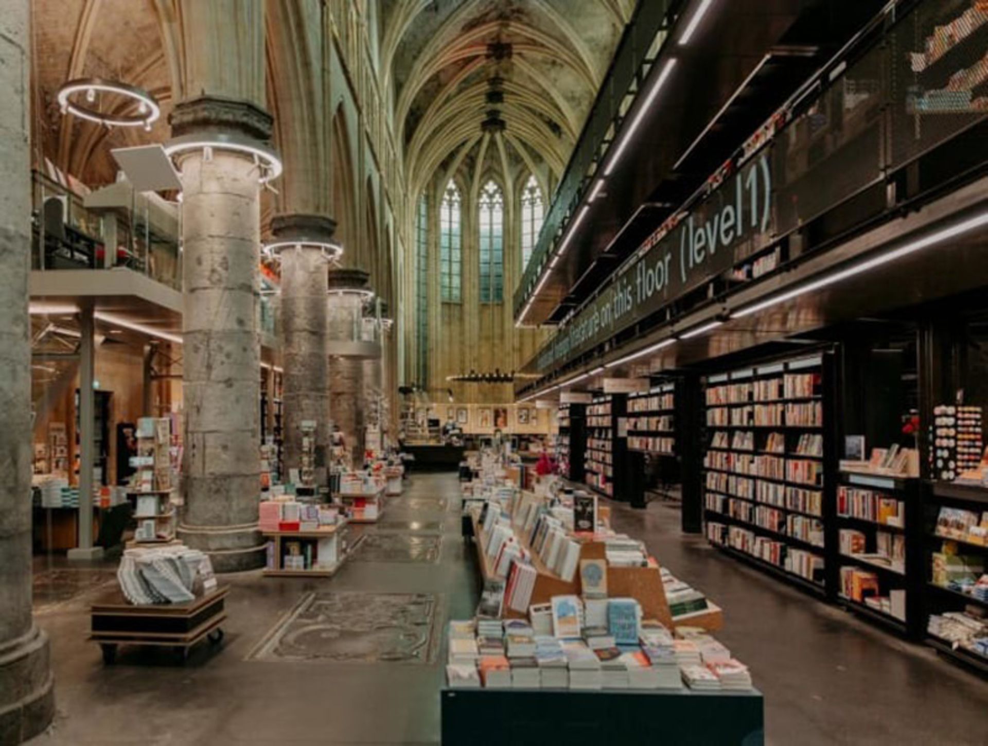 Dominican Bookstore Ierior with Stone Pillars and Gothic High Ceiling 