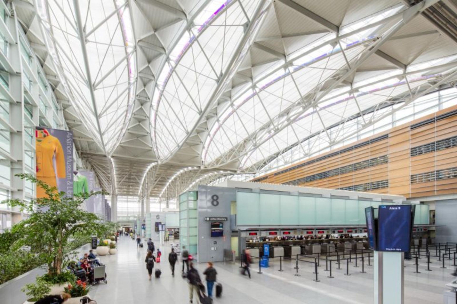 Passengers indoors in the ierior of San Francisco Iernational Airport 