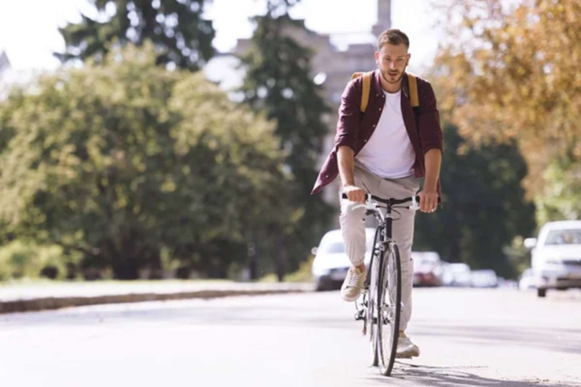 A man with a bicycling bag