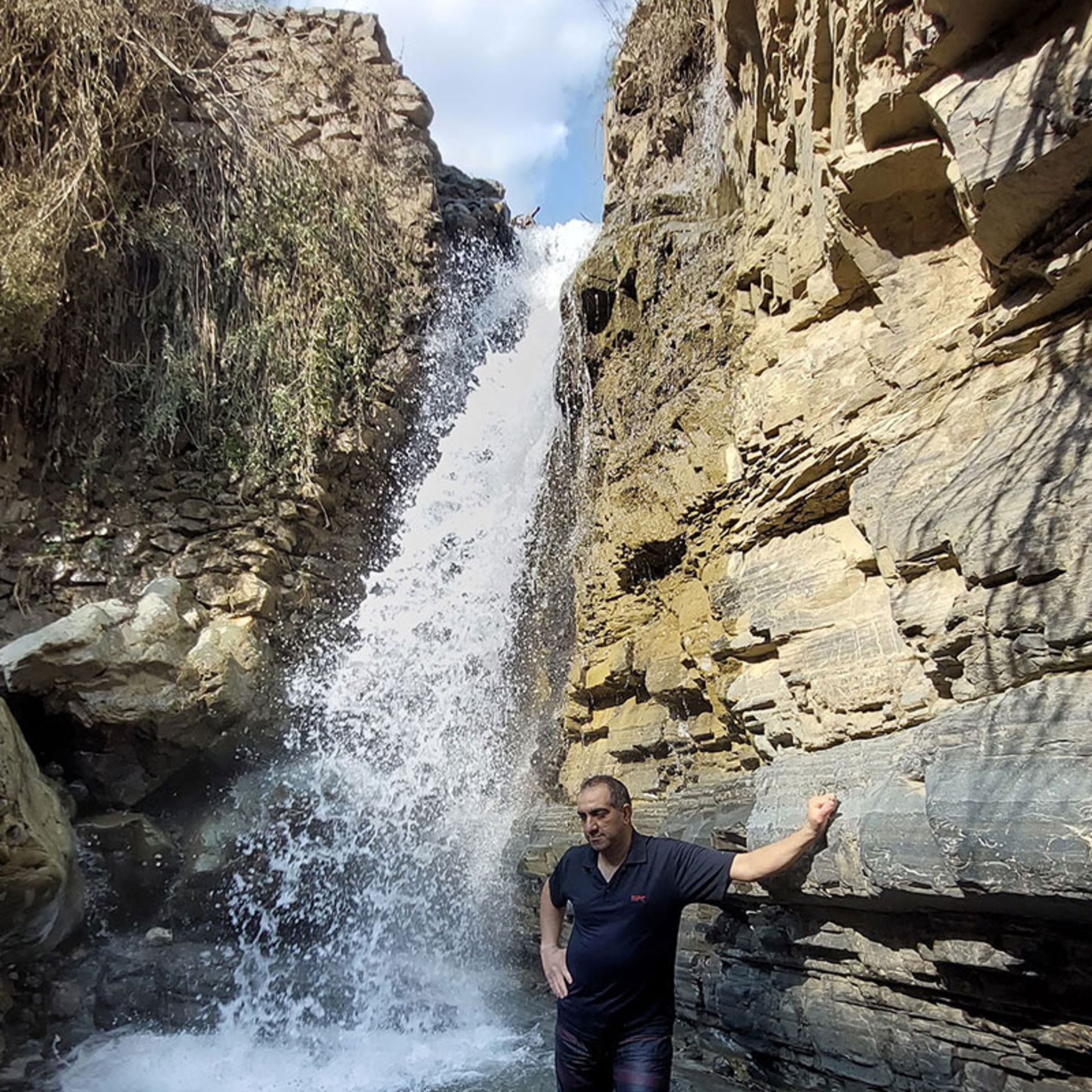 Male tourist alongside Siban Dara waterfall