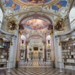 The interior of the magnificent Library of Adammine Monastery with a painted roof and Baroque architecture